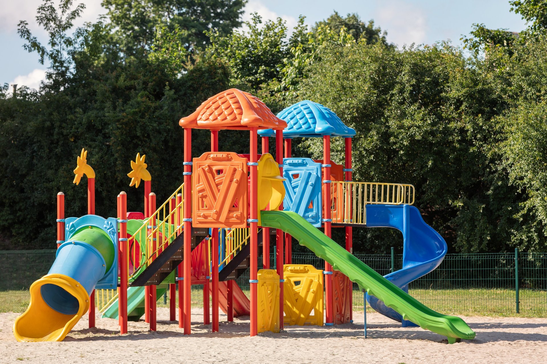 Outdoor playground equipment with slides