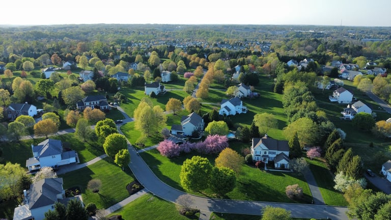 Aerial view of a residential community neighborhood with homes